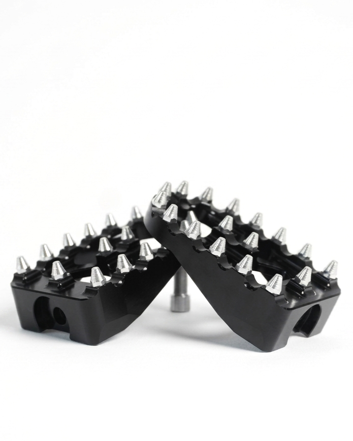 Black foot pegs from the Kaos Customs e-bike pedal delete kit